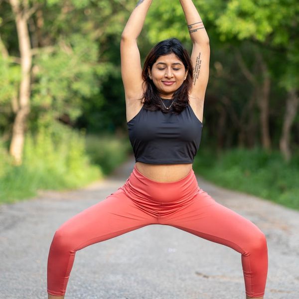Person in a focused yoga pose, symbolizing the mental clarity from practice.